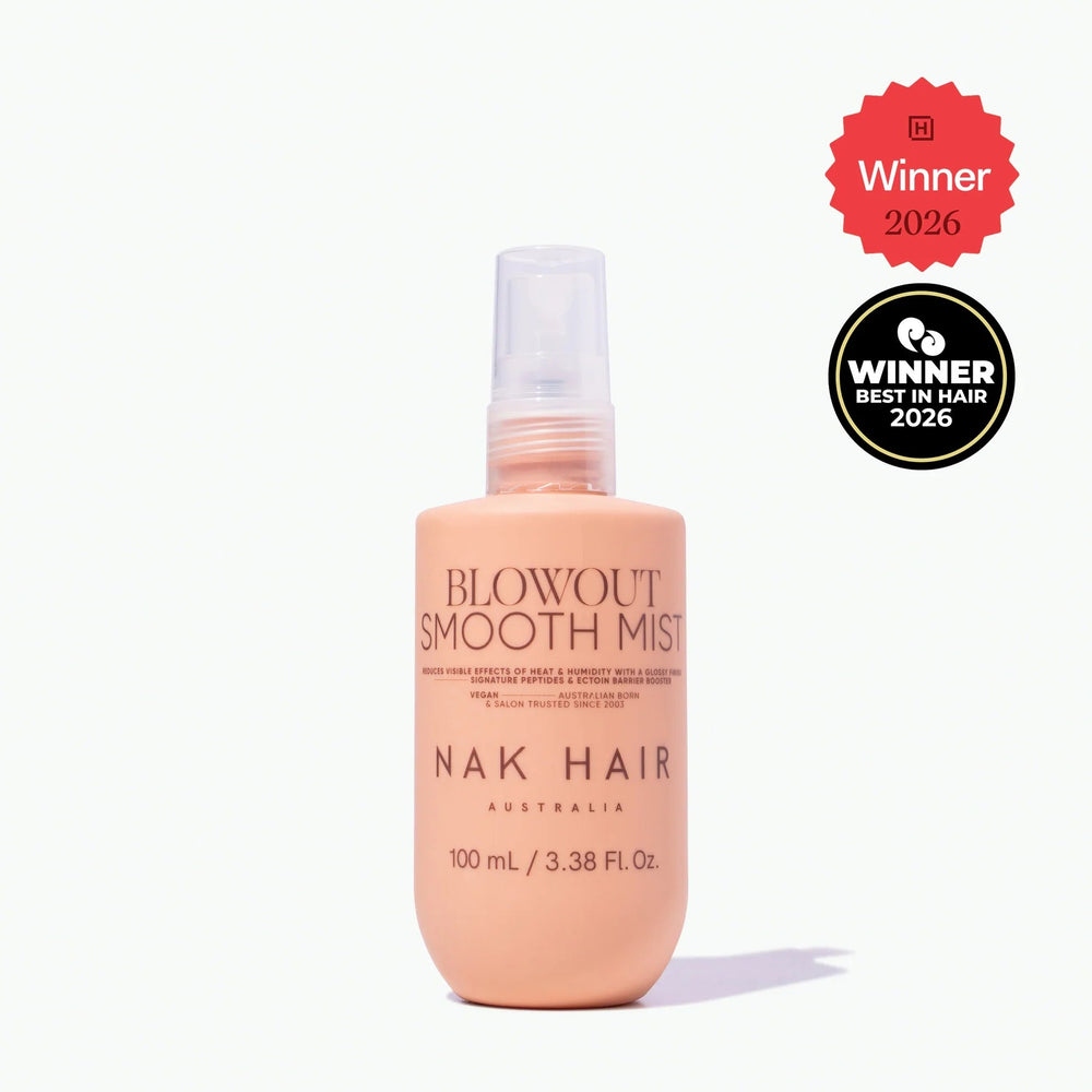 Nak Hair Blowout Smooth Mist bottle on a white background with awards displayed.
