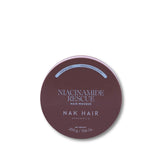 A round tin of NAK HAIR Niacinamide Rescue Hair Masque in a dusty mauve-brown shade, shown on a clean white background.