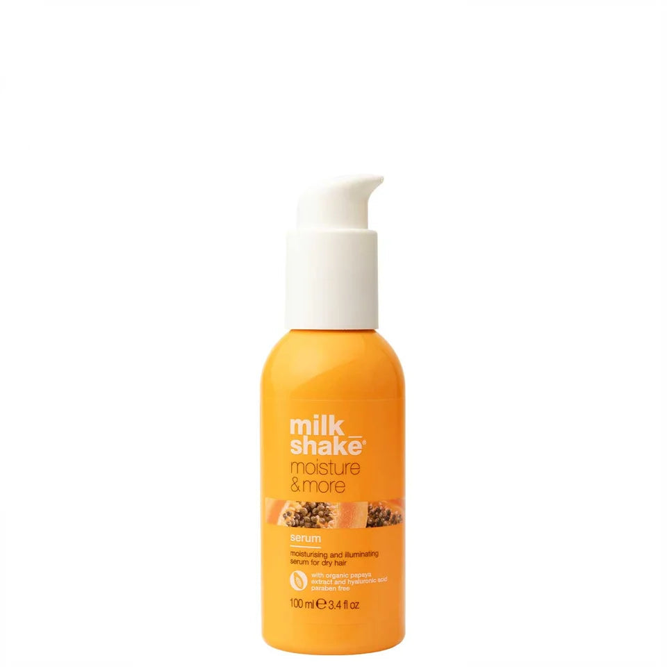 Orange bottle of 'milk shake moisture & more' hair product on a white background