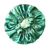 green satin hair bonnet on a white background