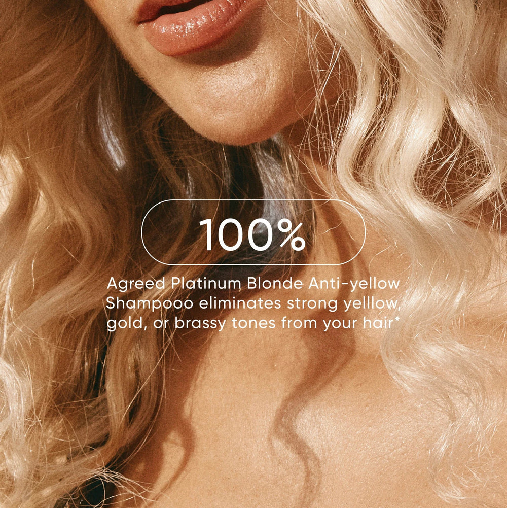 Close-up of a person with blonde hair, featuring text about Agreed Platinum Blonde Anti-yellow Shampoo.