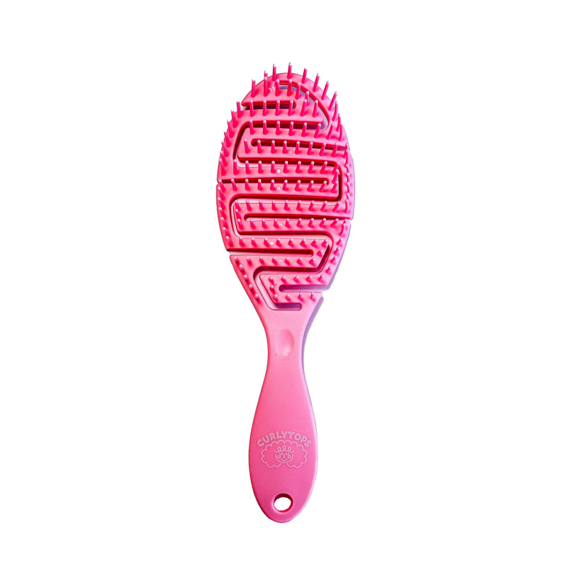 Pink curly  hairbrush on a white background
